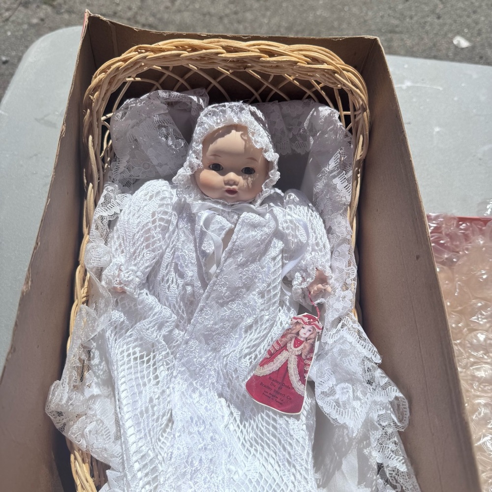 Vintage Bradley Christening porcelain doll in basket crib